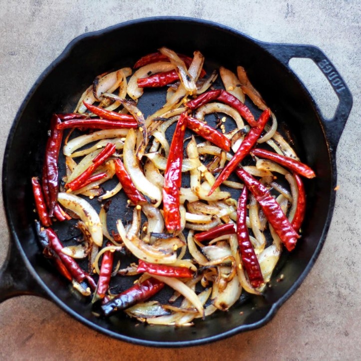 Onions and Arboral Peppers Cooking Down
