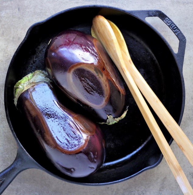 Baba G 5130 whole eggplants charring in skillet